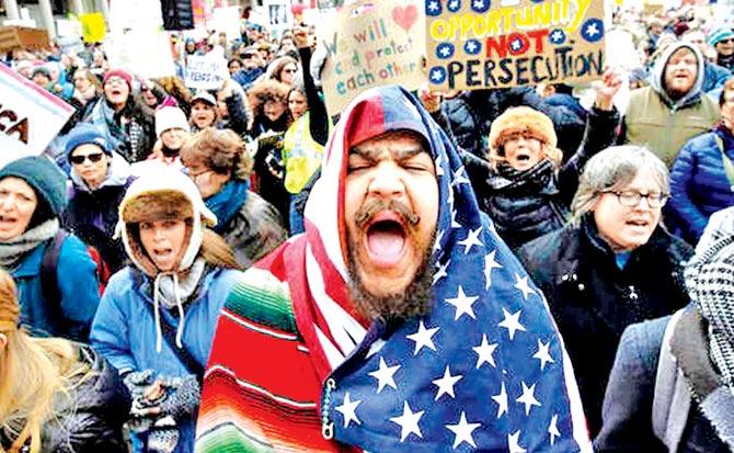 A protester in Boston chants slogans against US President Donald Trump’s travel ban order. Pic/AP