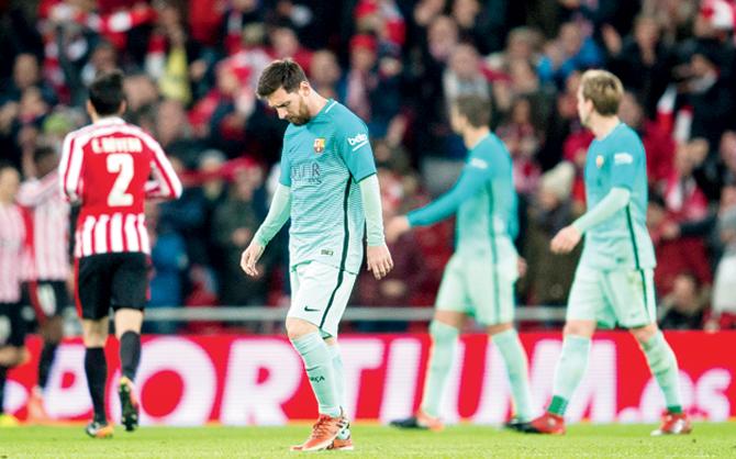 Barcelona’s Lionel Messi wears a dejected look after his team’s 1-2 defeat to Athletic Bilbao in the Copa del Rey Round-of-16 first-leg match at San Mames Stadium in Bilbao, Spain on Thursday. Pic/Getty Images