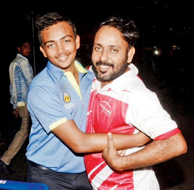 Prithvi Shaw (left) is greeted by his father Pankaj at Mumbai airport after arriving from Rajkot on Thursday night. Pic/Bipin Kokate 