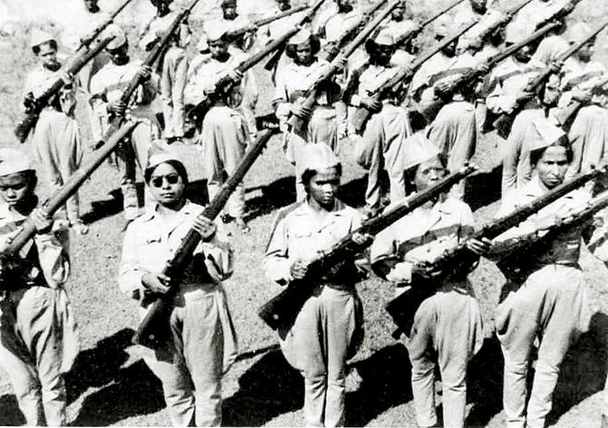 Ranis train with weapons built for northern European men in Singapore, 1944. Courtesy/Janaki Thevar Athinahappan