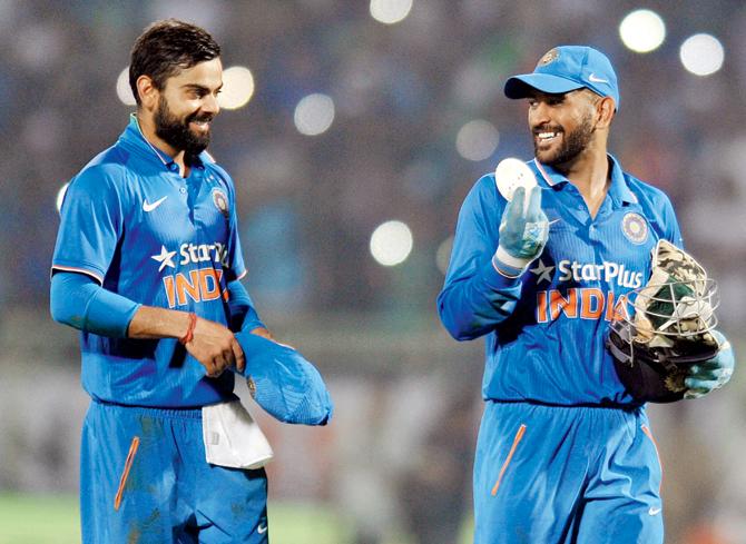 Virat Kohli and MS Dhoni during the fifth ODI vs NZ at Vizag in October. Pic/AFP