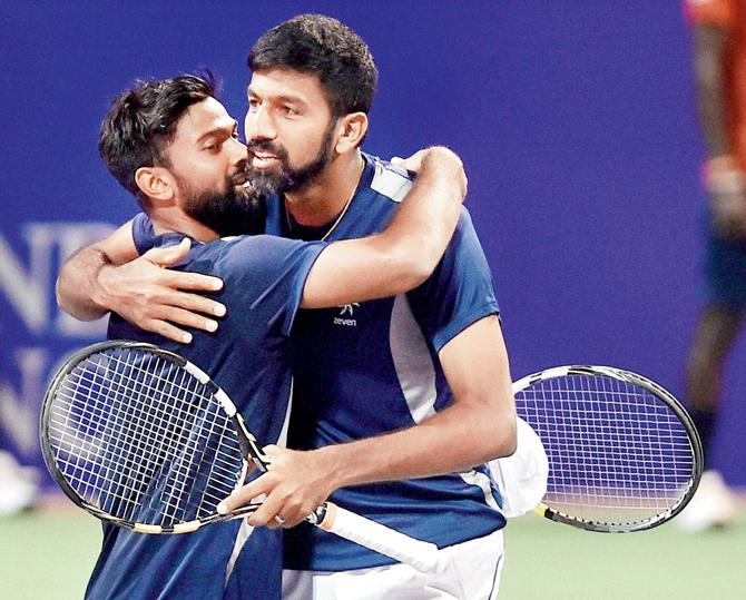 Rohan Bopanna and Jeevan Nedunchezhiyan after winning the Chennai Open doubles final yesterday. Pic/PTI