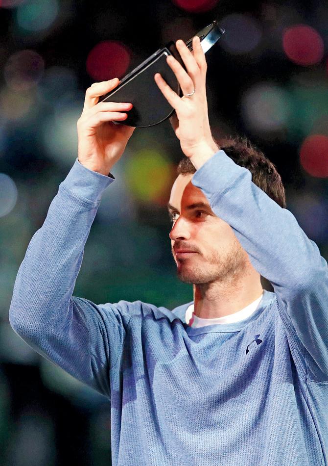 Andy Murray with the runners-up trophy after losing to Novak Djokovic 3-6, 7-5, 4-6 on Saturday. Pic/AFP