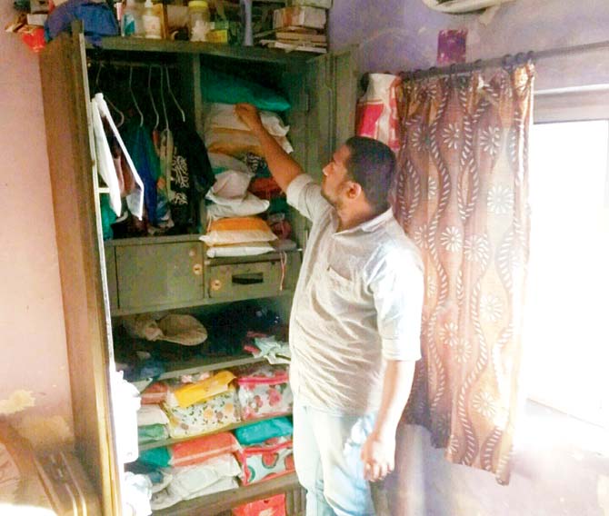 Akshay Chaudhary shows the cupboard from where the valuables were stolen