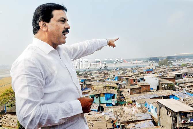 Former MLA and Congress leader Arif Naseem Khan points to the Krantinagar slums near the airport. Pic/Datta Kumbhar