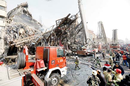 20 firefighters die as Iran's oldest high-rise collapses
