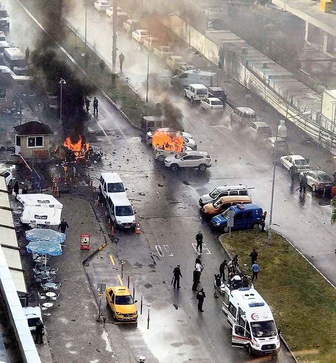 Cars burn after the explosion in Izmir. Pic/AFP