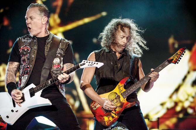 James Hetfield (left) and Kirk Hammett at a Metallica concert. Pic/AFP