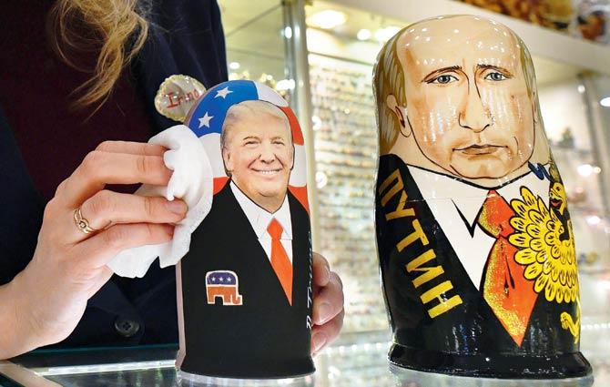 Traditional Russian wooden nesting dolls, Matryoshka dolls, depicting US President-elect Donald Trump and Russian President Vladimir Putin, at a gift shop in Moscow on Monday. Pic/AFP