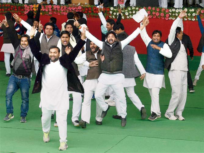 SP workers celebrate after the decision elevating Akhilesh. Pics/PTI