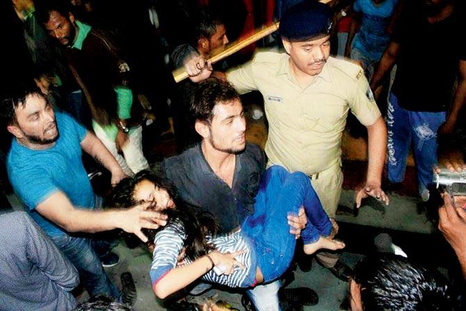 One of the injured persons at Vadodara being carried to safety