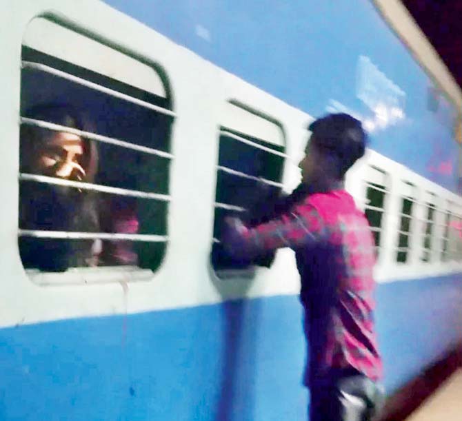 Terror accused Mustafa Dossa’s wife, Shabina Khatri, at the Ahmedabad railway station on a train carrying him to a trial in Porbandar