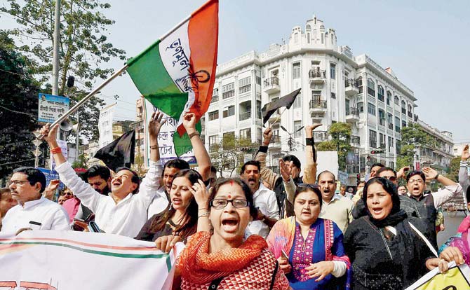 Trinamool Congress activists at a protest rally in Kolkata. Pic/PTI