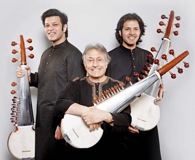 Ustad Amjad Ali Khan, with his sons, Amaan Ali Bangash (left) and Ayaan Ali Bangash who are also his disciples