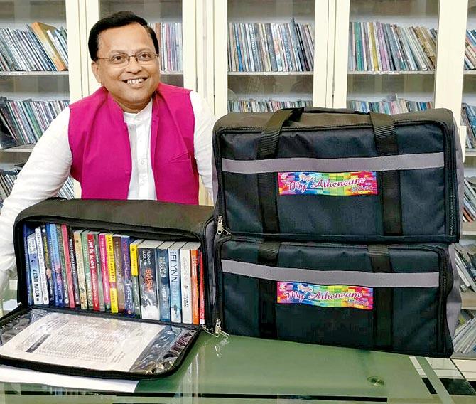 Vinayak Ranade with the book bags