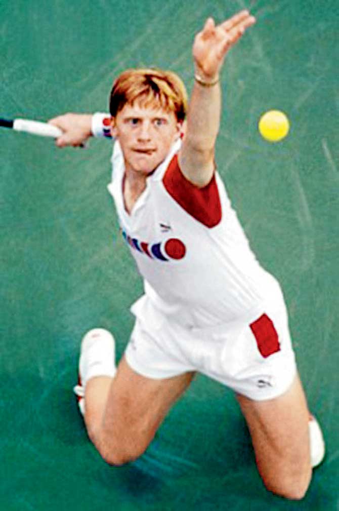 Boris Becker, with his tongue out, serves during the 1990s