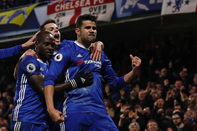 Diego Costa (R) celebrates with teammates after scoring the opening goal 