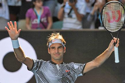 Australian Open: Roger Federer wobbles but roars back to reach third round