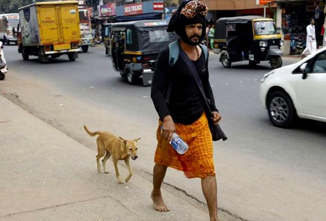 Malu the dog followed 38-year-old Naveen to Sabarimala. Pic courtesy/Facebook
