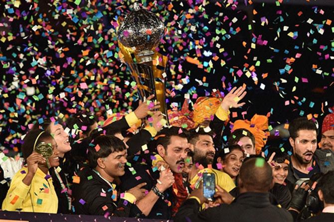 Punjab Royals co-owner Bobby Deol and players celebrate with Pro Wrestling League Season 2 Trophy after beat Haryana Hammers, in New Delhi on Thursday. Pic/ PTI