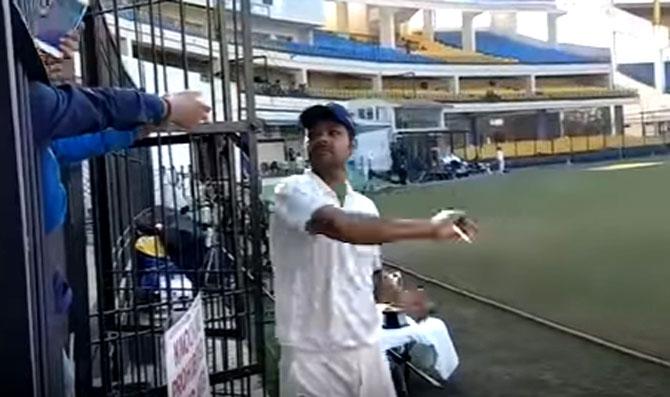 RP Singh snatches the phone from the fan