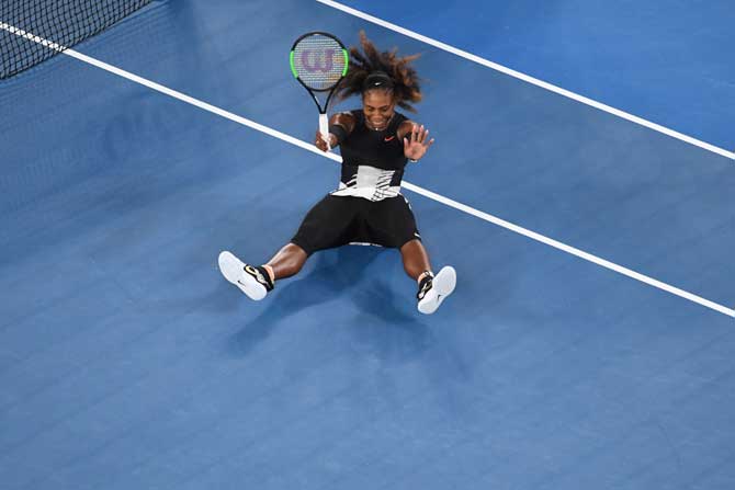 Serena Williams of the US reacts after beating Venus Williams of the US to win their women