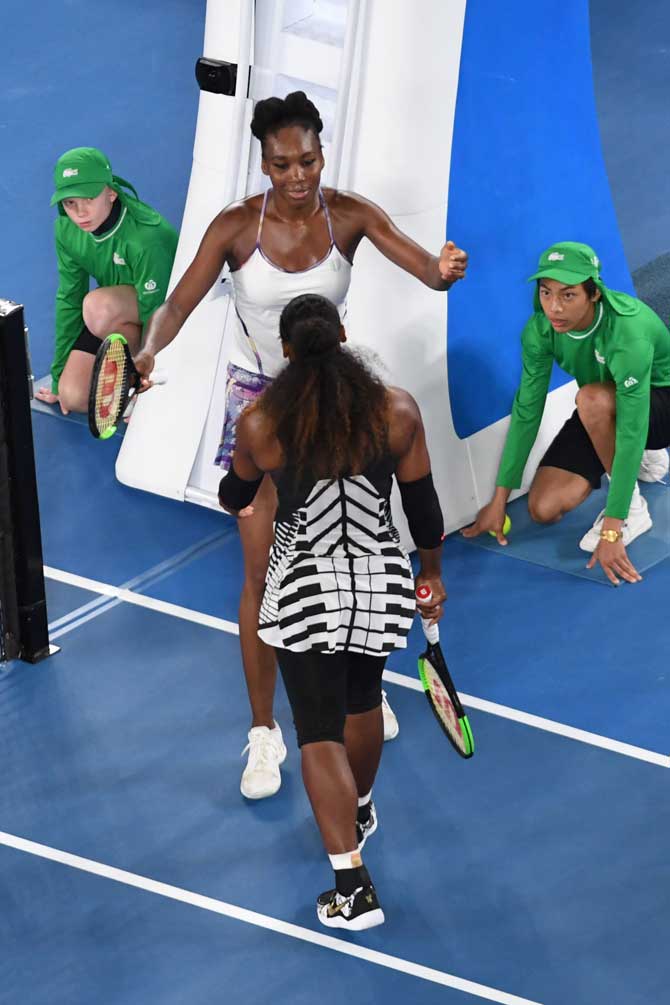 Venus hugs Serena Williams after the latter beat her to win their women