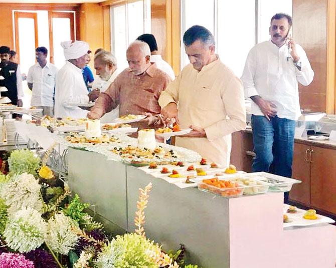 Gujarat Congress legislators at the Bengaluru resort, where they have been pictured enjoying lavish buffets. Pic/ANI News