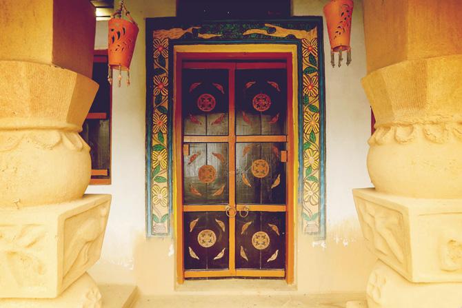 A door featuring Pyatkar art at Amadubi Rural Tourism Centre near Jamshedpur