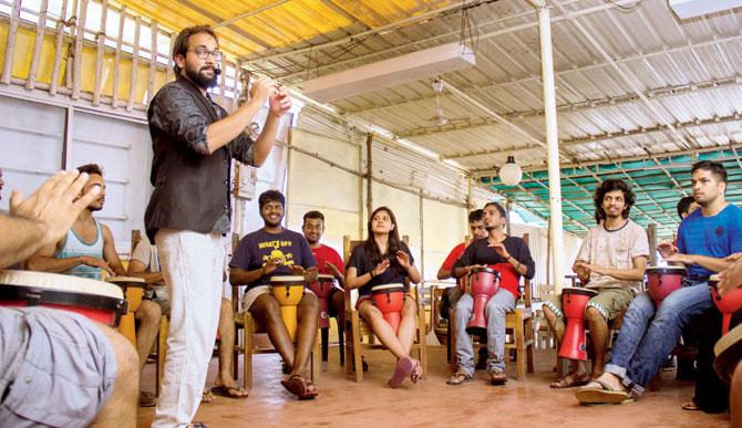 Aman Joshi leads a drum circle in Goa