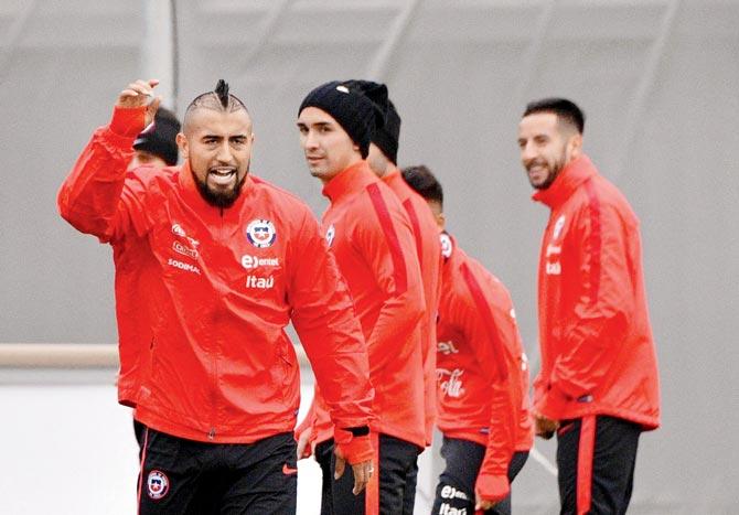Chile’s midfielder Arturo Vidal (left) reacts during a training session in Saint Petersburg prior to the Confederations Cup final against Germany on Friday. Pic/AFP