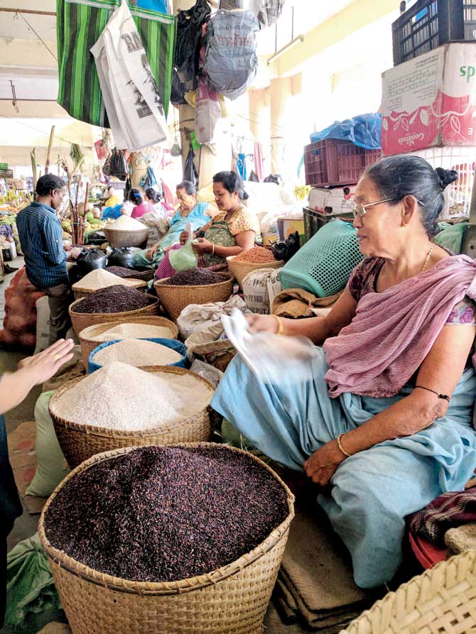 A local sells black rice in Ima market in Imphal, Manipur. It