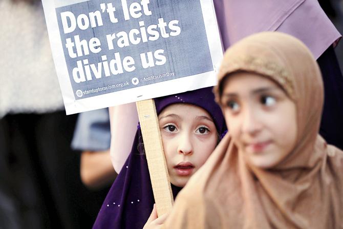 Children attend a vigil outside Finsbury Park Mosque. file pic