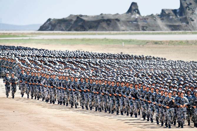 Chinese soldiers march in a military parade at the Zhurihe training base. Pics/AP, AFP
