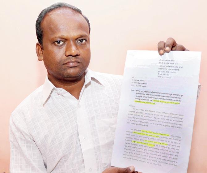 Activist Rajesh Jadhav shows a complaint letter sent to the BMC on the Ramgarh Nagar (right) issue