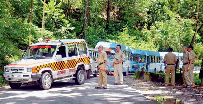 Police escort state buses in Darjeeling