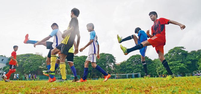 Don Bosco players sweat it out during a practice session at their school ground in Matunga recently. Pic/Atul Kamble