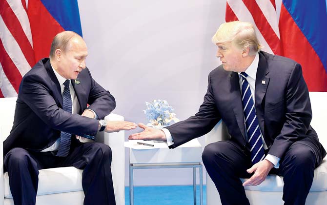 Donald Trump and his Russian counterpart Vladimir Putin shake hands during a meeting on the sidelines of the G20 Summit. Pics/AFP
