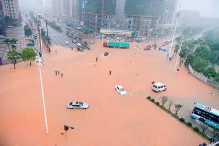 Flooding in China kills 33 and leaves thousands homeless
