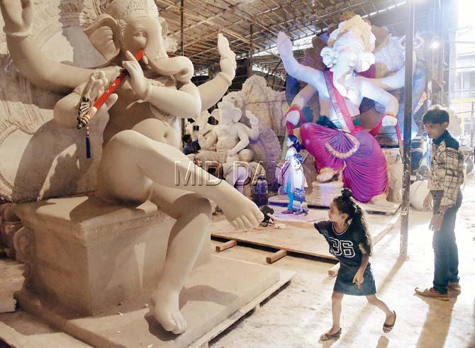 While Ganesha idols have become more expensive because of a rise in cost of materials, sculptors are not sure whether they are supposed to charge GST to customers as well. Pic/Pradeep Dhivar