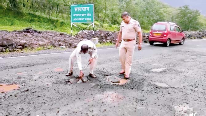 Highway traffic officials examining the dangerous potholes that need immediate repairs