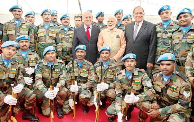 Prime Minister Narendra Modi and Israeli Prime Minister Benjamin Netanyahu with the Indian contingent of UN’s Interim Force in Lebanon, at the World War I Indian Army cemetery, in Haifa. PIC/PTI