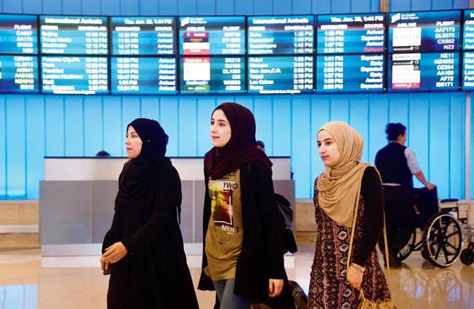 Travellers from the Middle East arrive at the International Arrivals section at Los Angeles International Airport. Pic/AFP