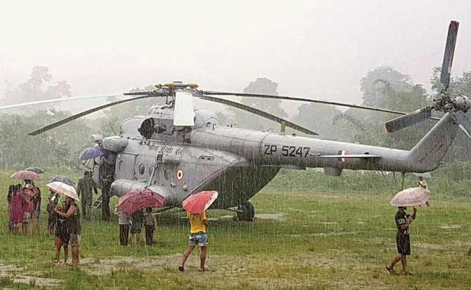 Local residents gather around Union minister Kiren Rijiju