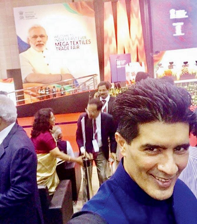 Designer Manish Malhotra shoots a selfie in the exhibition area