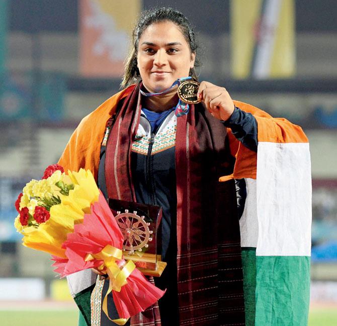 Shot-putter Manpreet poses with her gold medal. Pic/PTI