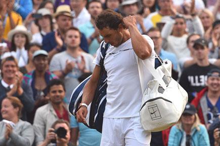 Wimbledon: Rafael Nadal knocked out by Gilles Muller in five-set epic