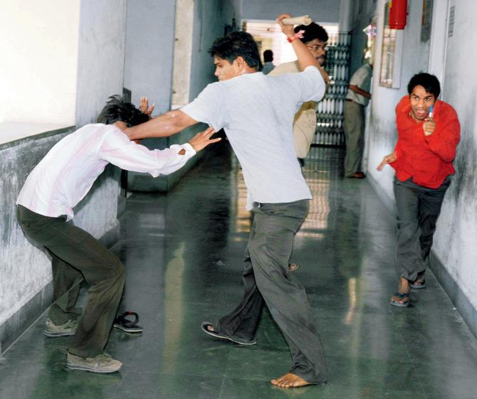 MNS activists attacking North Indians who appeared for the Railway examination at Vidya Bhavan School, Nerul, in 2008
