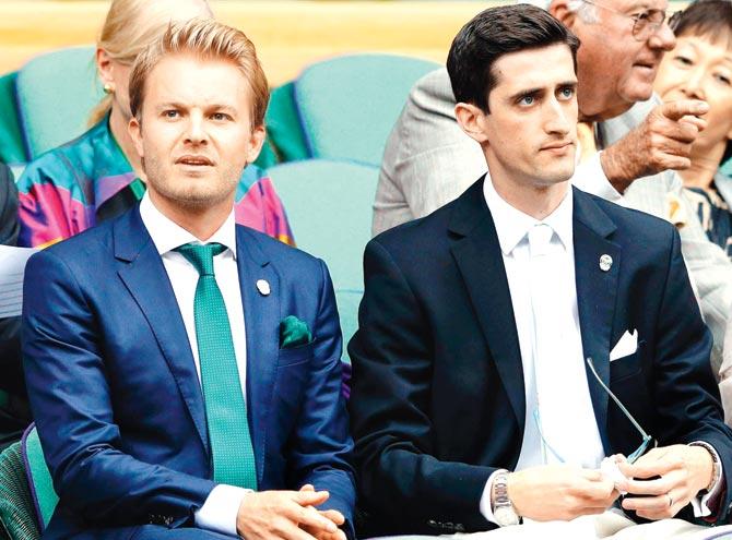 Ex-F1 champ Nico Rosberg (left) at Wimbledon yesterday