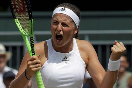 Wimbledon: Jelena Ostapenko makes quarters to keep double dream alive